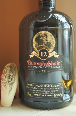 Bunnahabhain 12, with a maritime trinket, Maine scrimshaw.